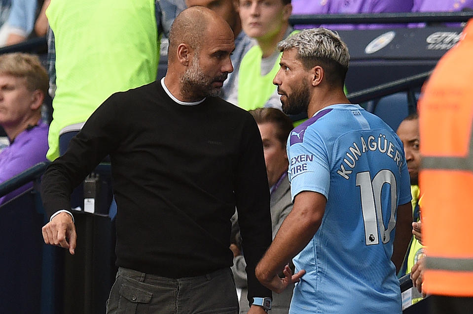 Manchester City's Argentinian striker Sergio Aguero (R) talks with manager Pep Guardiola as he is substituted off. (Photo credit should read OLI SCARFF/AFP/Getty Images)