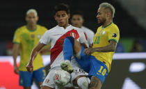 Brazil's Neymar, right, and Peru's Carlos Lora battle for the ball during a Copa America semifinal soccer match at Nilton Santos stadium in Rio de Janeiro, Brazil, Monday, July 5, 2021. (AP Photo/Silvia Izquierdo)