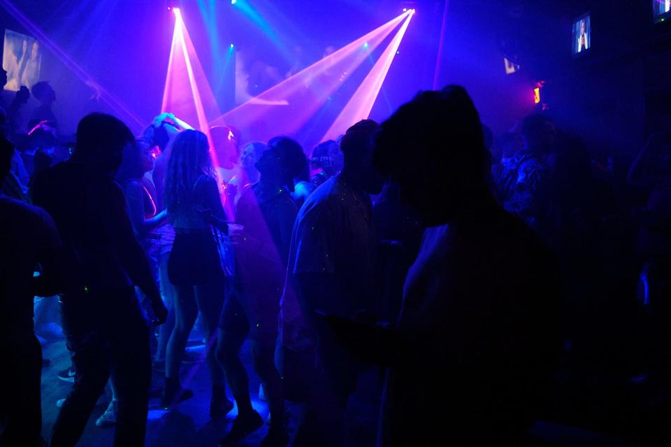 Dancers move in the dark during the long-running Tuezgayz dance night in 2021 at Barbarella.