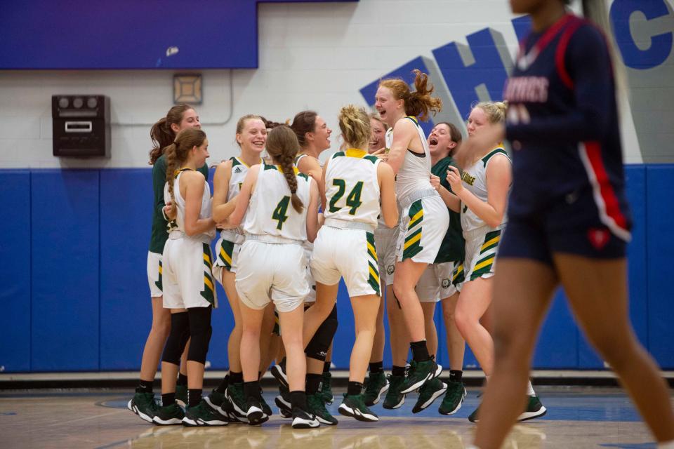 Rock Bridge (Mo.) celebrates after defeating Sacred Heart (Ky.) 40-36 to win the Naples Holiday Shootout 2021 American Division championship between, Thursday, Dec. 30, 2021, at Barron Collier High School in Naples, Fla.