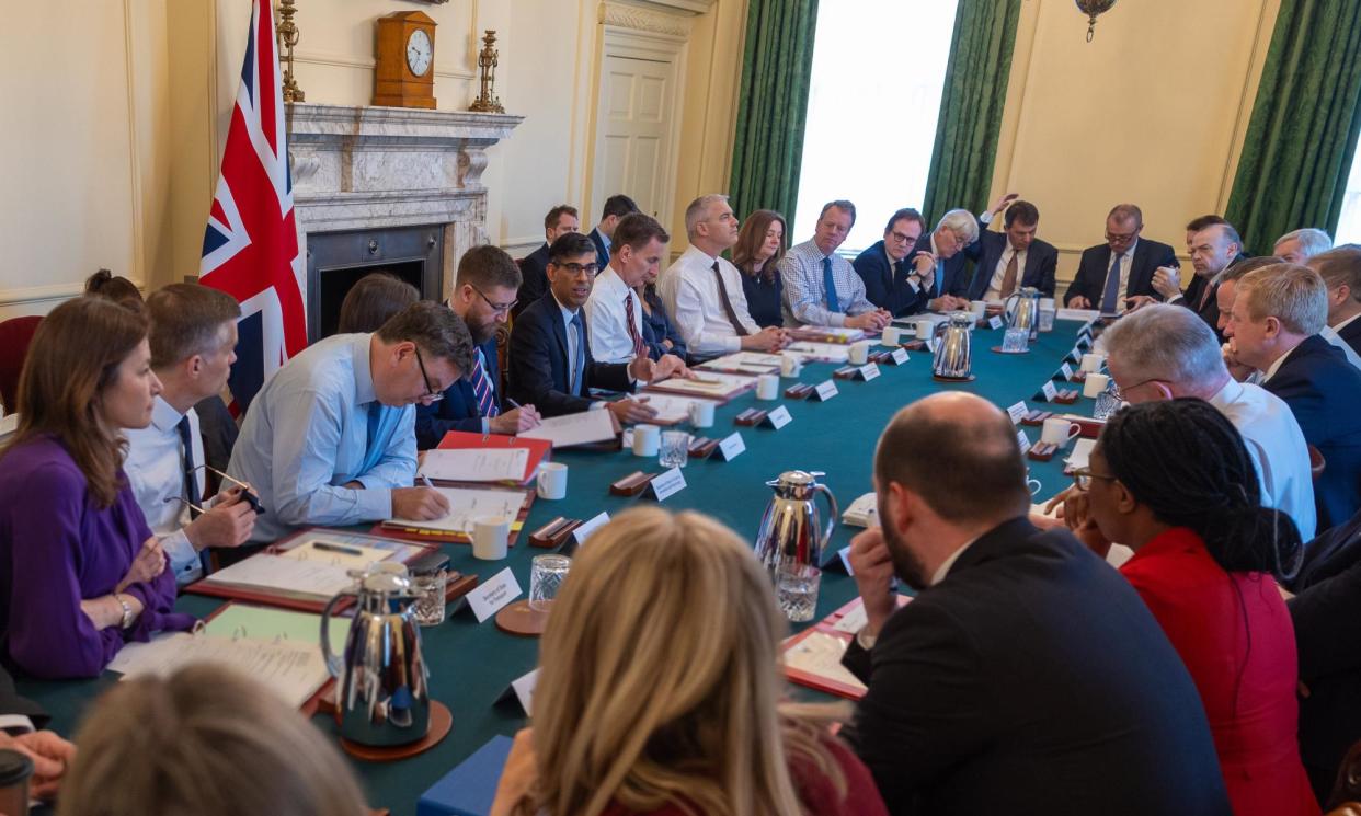 <span>A meeting of the cabinet last week. More than a dozen of its ministers are projected by Survation to lose at the next general election.</span><span>Photograph: Simon Walker/No 10 Downing Street</span>