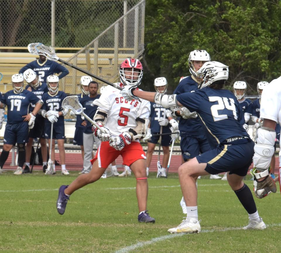 Saint Andrews' Nick Testa passes the ball to a fellow attacker during the Scots' game against Calvary Christian on April 11, 2024.