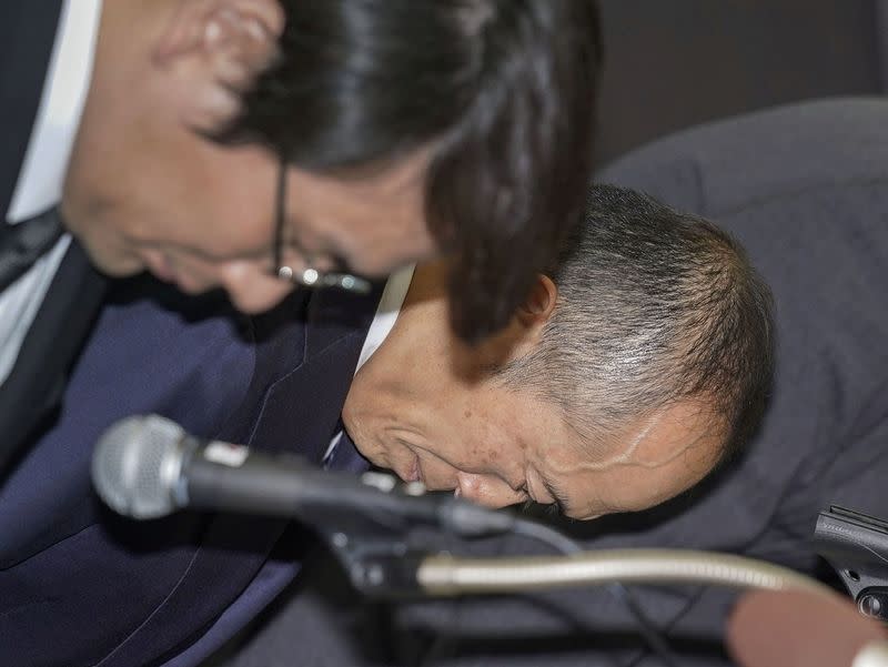 Kobayashi Pharmaceutical Co. President Akihiro Kobayashi apologizes at a press conference in Osaka