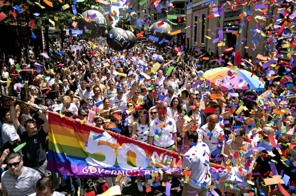 New York Governor Andrew Cuomo, lower front center, joins people participating in the LBGTQ Pride march Sunday, June 30, 2019, in New York. (AP Photo/Craig Ruttle)