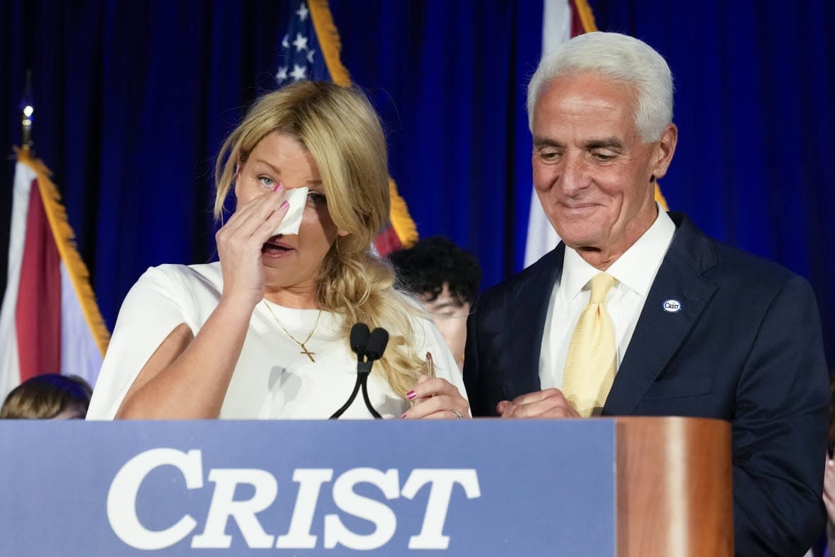 Democratic gubernatorial candidate Rep. Charlie Crist, with his fiancee Chelsea Grimes, speaks to supporters on election night, Tuesday, Nov. 8, 2022, in St. Petersburg, Florida. He lost his bid for governor to Republican incumbent Ron DeSantis.(AP Photo/Chris O’Meara)