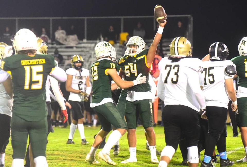 Hilmar High School senior defensive lineman Jackson Takhar (64) recovered a backward pass from Pioneer for a Yellowjackets’ turnover during Thursday’s playoff game at Hilmar High School.