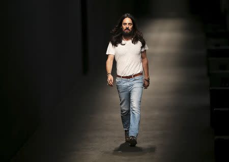 Italian designer Alessandro Michele appears at the end of the Gucci Autumn/Winter 2016 woman collection during Milan Fashion Week, Italy, February 24, 2016. REUTERS/Stefano Rellandini