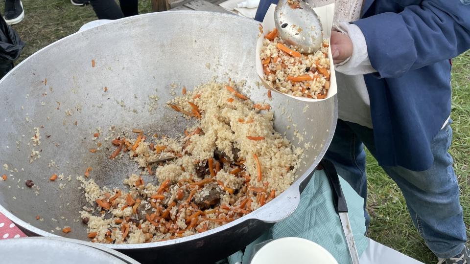 a man cooking food outside