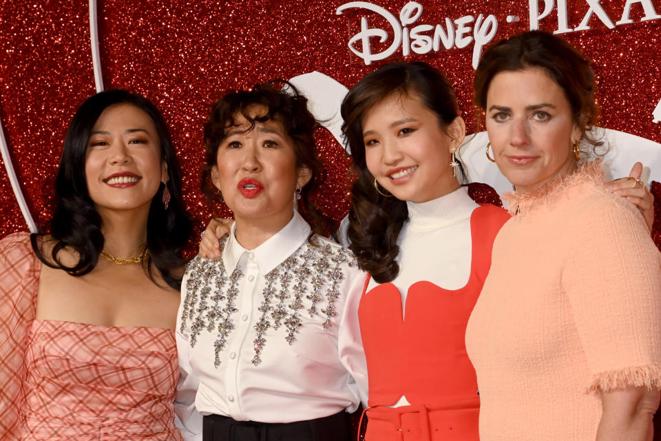 LONDON, ENGLAND - FEBRUARY 21: Domee Shi, Rosalie Chiang, Sandra Oh and Lindsay Collins attend the UK Gala screening of 