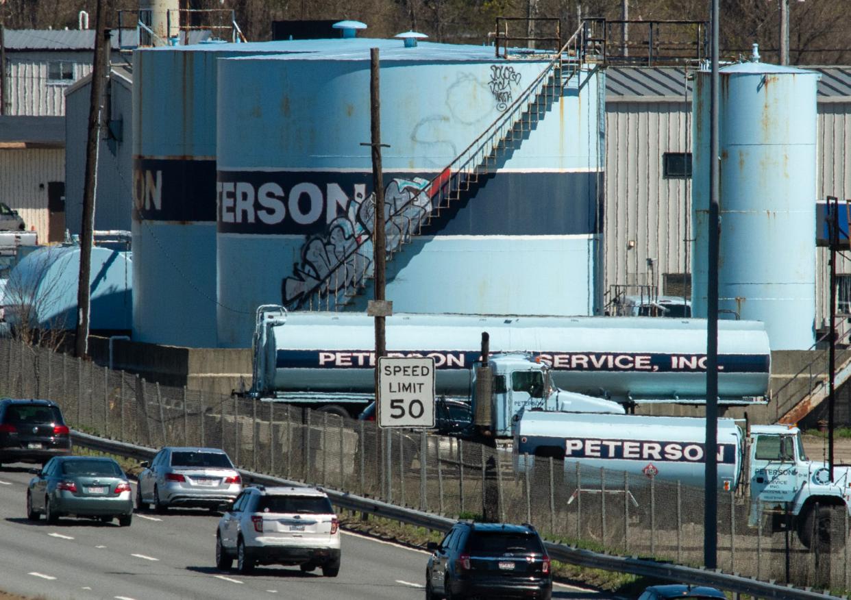 Traffic on Interstate 290 passes the Peterson Oil facility in Worcester Thursday.