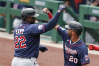 Minnesota Twins' Miguel Sano (22) celebrates with Eddie Rosario (20) after driving him and Jorge Polanco in with a three-run home run in the first inning of a baseball game against the Pittsburgh Pirates, Thursday, Aug. 6, 2020, in Pittsburgh. (AP Photo/Keith Srakocic)