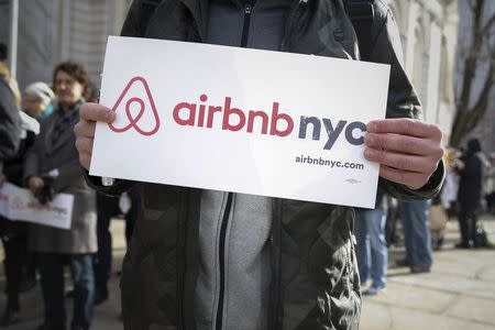 Supporters of Airbnb stand during a rally before a hearing called "Short Term Rentals: Stimulating the Economy or Destabilizing Neighborhoods?" at City Hall in New York, U.S. on January 20, 2015. REUTERS/Shannon Stapleton/File Photo