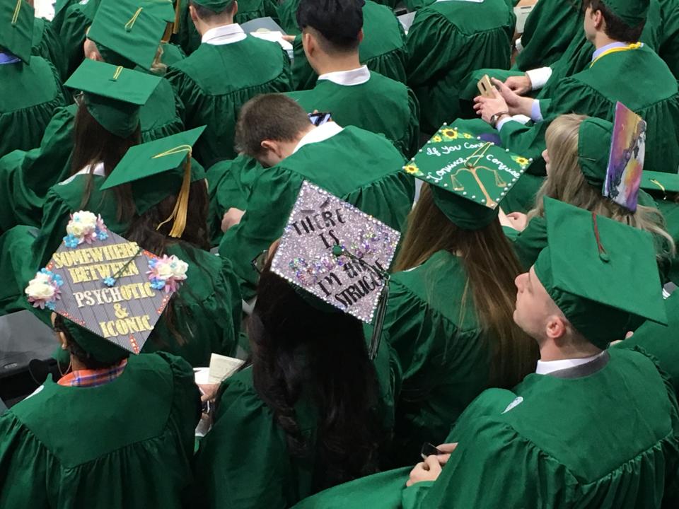 The Class of 2018 racked up an average of $29,200 in college loans to obtain bachelor's degrees — a record in the United States, according to the latest report by the Institute for College Access & Success. 
The average in Michigan was even higher at $32,158, where 59% of graduates carry some college debt along with that diploma.  File photo taken at Michigan State University's Fall 2019 Commencement at the Breslin Center on Dec. 14.
