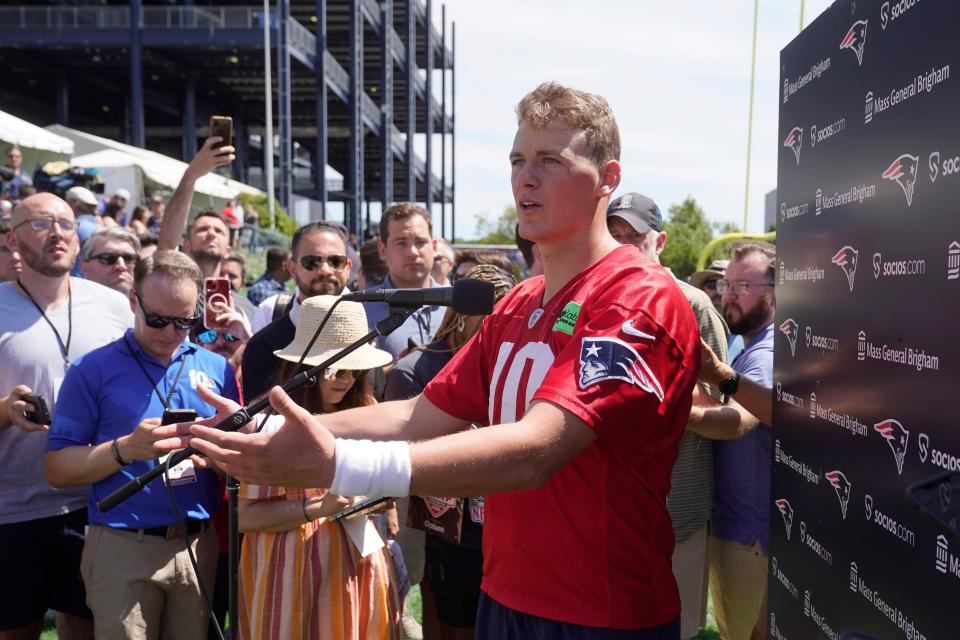 New England Patriots quarterback Mac Jones faces reporters following training camp at the NFL football team's practice facility, Wednesday, July 27, 2022, in Foxborough, Mass.