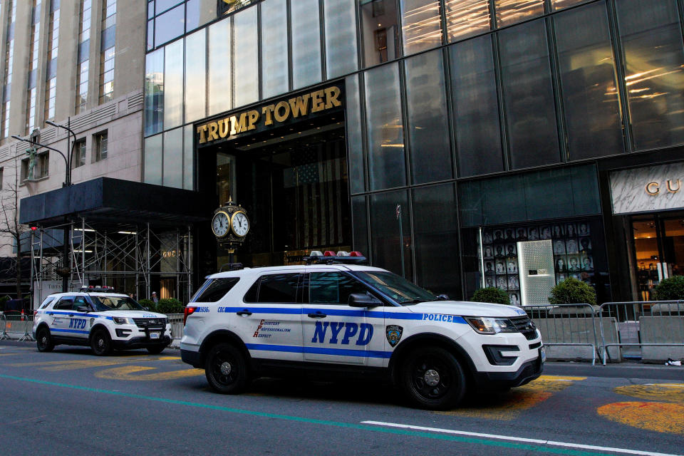 Two NYPD cars parked in front of Trump Tower.