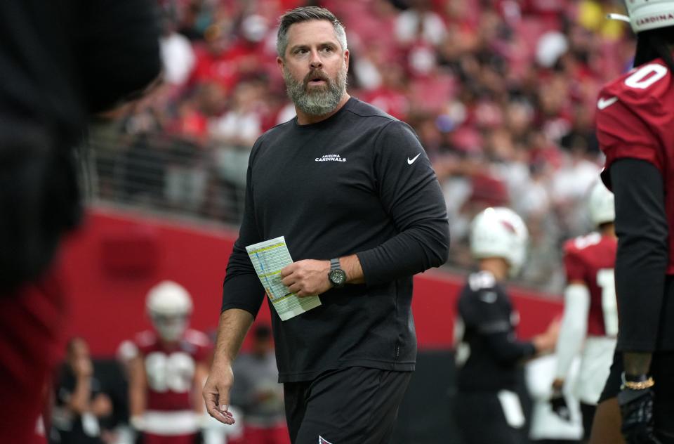 Defensive Line Coach Matt Burke works out his team during the Arizona Cardinals Back Together Saturday Practice at State Farm Stadium in Glendale, Ariz. on Saturday, July 30, 2022. 