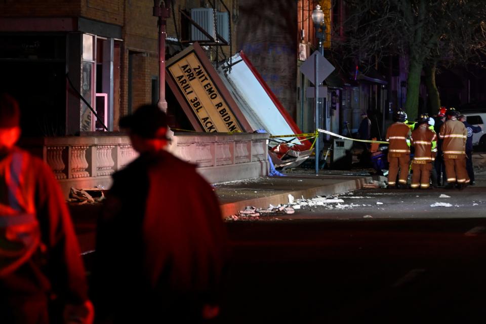 Authorities work the scene at the Apollo Theatre after a severe spring storm caused damage and injuries during a concert, late Friday, March 31, 2023, in Belvidere, Ill. (AP Photo/Matt Marton)