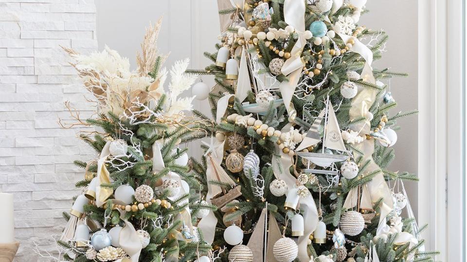 a nautical christmas tree with presents underneath