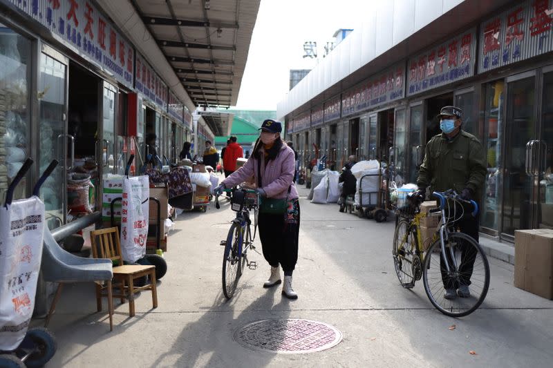 People visit the Xinfadi wholesale market in Beijing