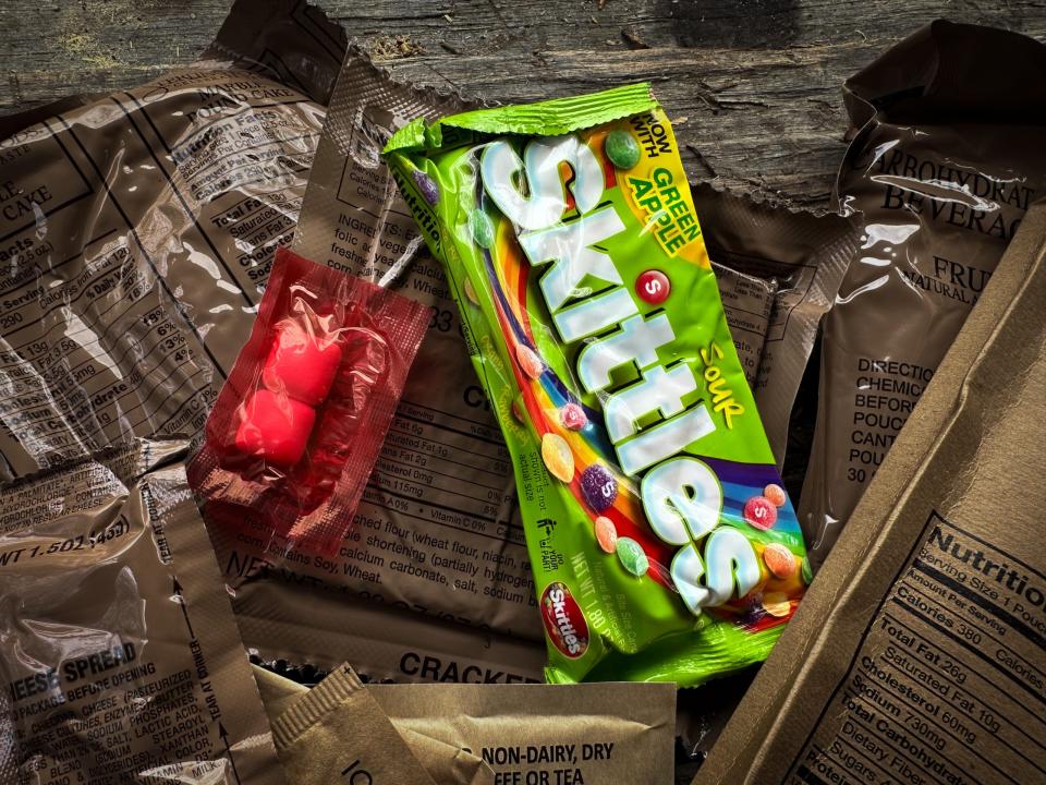 Packs of gum and candy inside a MRE package.