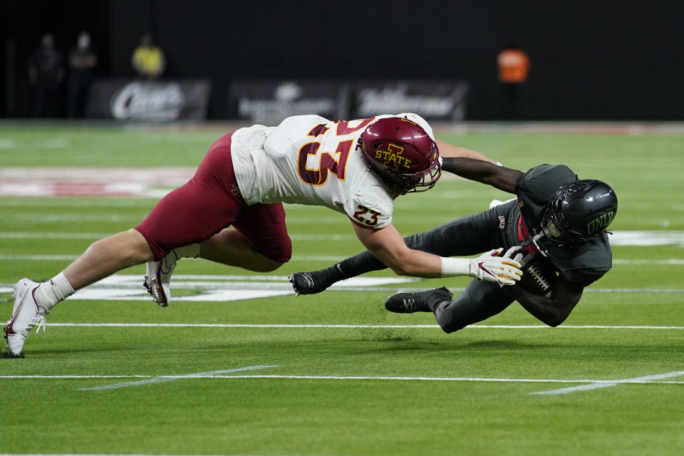 Iowa State linebacker Mike Rose (23) tackles UNLV running back Courtney Reese (26) during the second half of an NCAA college football game Saturday, Sept. 18, 2021, in Las Vegas. (AP Photo/John Locher)