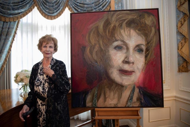 Edna O'Brien stands beside her portrait portrait