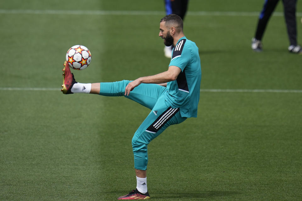 Real Madrid's Karim Benzema controls the ball during a Media Opening day training session in Madrid, Spain, Tuesday, May 24, 2022. Real Madrid will play Liverpool in Saturday's Champions League soccer final in Paris. (AP Photo/Manu Fernandez)