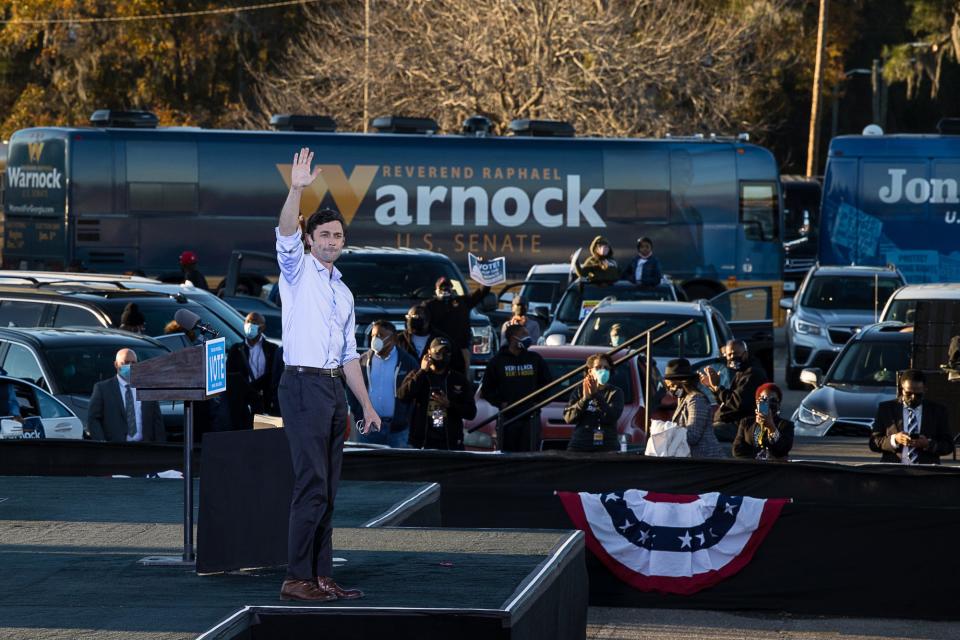Senate candidate Jon Ossoff waves at the crowd after speaking Sunday during a campaign event with Rev. Raphael Warnock and Vice President Elect Kamala Harris Sunday evening at Garden City Stadium. (Richard Burkhart/Savannah Morning News)