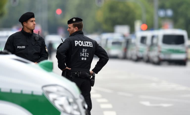 Police officers secure the area around the shopping mall Olympia Einkaufzentrum OEZ in Munich on July 23, 2016, a day after a gunman went on a shooting rampage