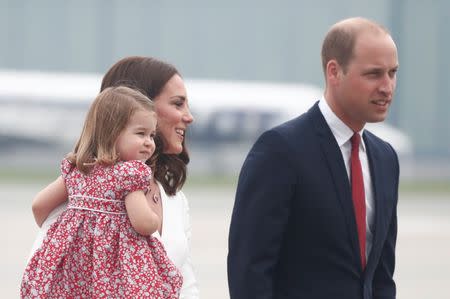 Prince William, the Duke of Cambridge, his wife Catherine, The Duchess of Cambridge and Princess Charlotte arrive at a military airport in Warsaw, Poland July 17, 2017. REUTERS/Kacper Pempel