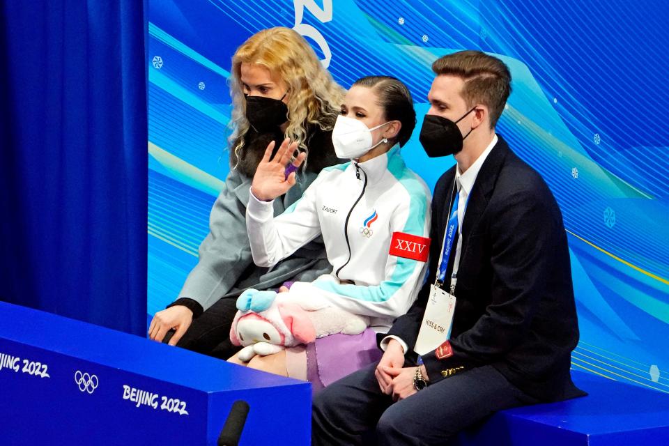 Russian coach Eteri Tutberidze, left, and figure skater Kamila Valieva, center, at the 2022 Beijing Olympics.