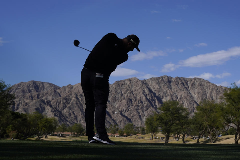 Jon Rahm hits from the third tee during the third round of the American Express golf tournament on the Pete Dye Stadium Course at PGA West Saturday, Jan. 22, 2022, in La Quinta, Calif. (AP Photo/Marcio Jose Sanchez)