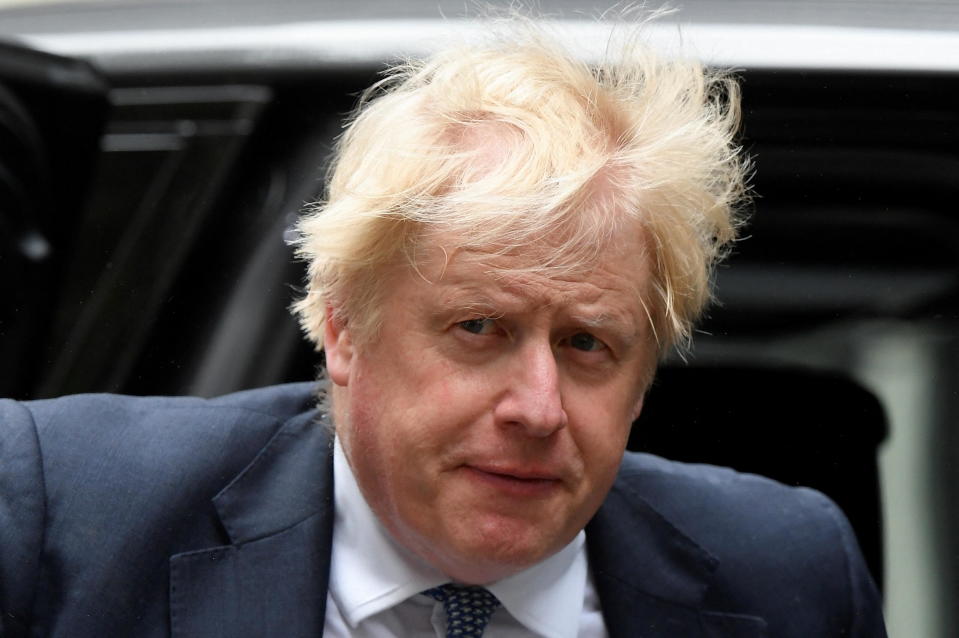 British Prime Minister Boris Johnson returns to 10 Downing Street after taking questions in parliament, in London, May 25, 2022. / Credit: TOBY MELVILLE/REUTERS