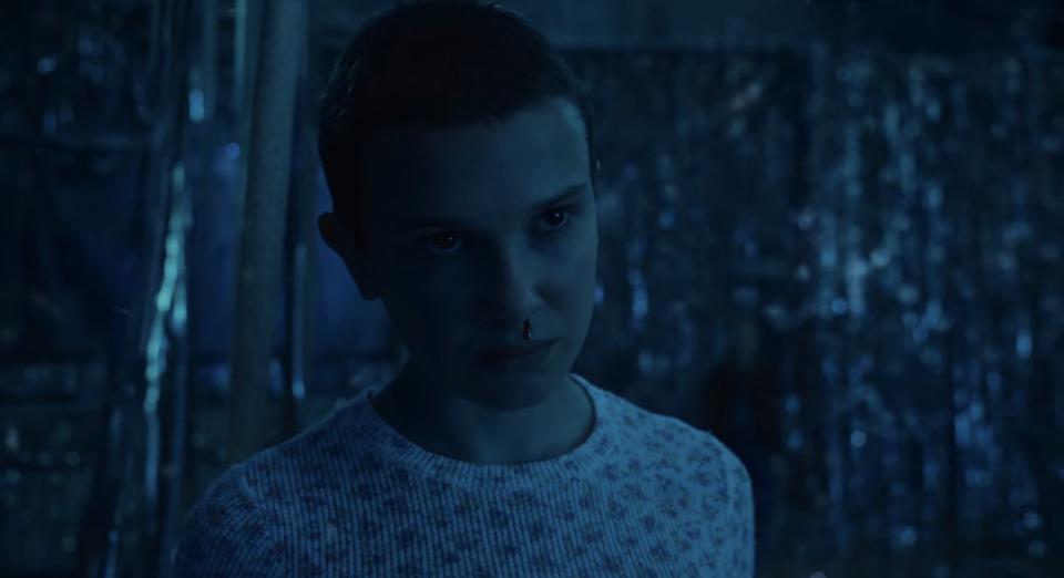 Eleven in an illusory recreation of the Snow Ball in "Stranger Things"