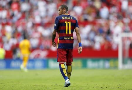 Barcelona's Neymar walks during their Spanish first division soccer match against Sevilla at Ramon Sanchez Pizjuan stadium in Seville, southern Spain, October 3, 2015. REUTERS/Marcelo del Pozo