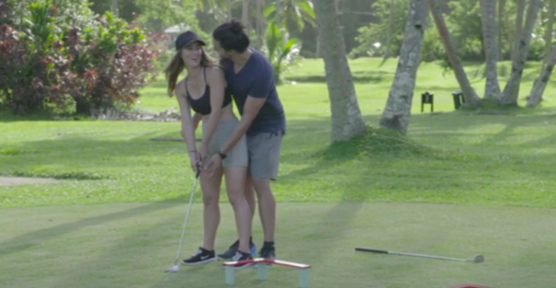 Lucky a man is here to help - Rach was about to cluelessly swallow the golf club whole like the silly woman she is! Photo: Channel Ten