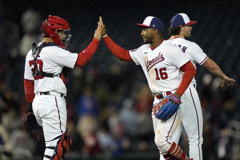 Washington Nationals center fielder Victor Robles (16) and catcher Keibert Ruiz, celebrate after winning a baseball game against the Chicago Cubs in Washington, Wednesday, May 3, 2023. (AP Photo/Manuel Balce Ceneta)