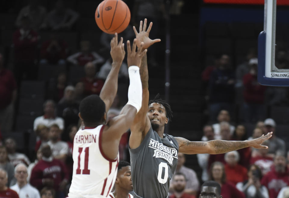 Mississippi State guard Nick Weatherspoon (0) tries to stop a shot by Oklahoma guard De'Vion Harmon (11) during the second half of an NCAA college basketball game in Oklahoma City, Saturday, Jan. 25, 2020. (AP Photo/Kyle Phillips)