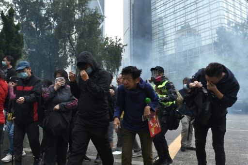 Riot police swept into the area and fired tear gas to disperse the crowds