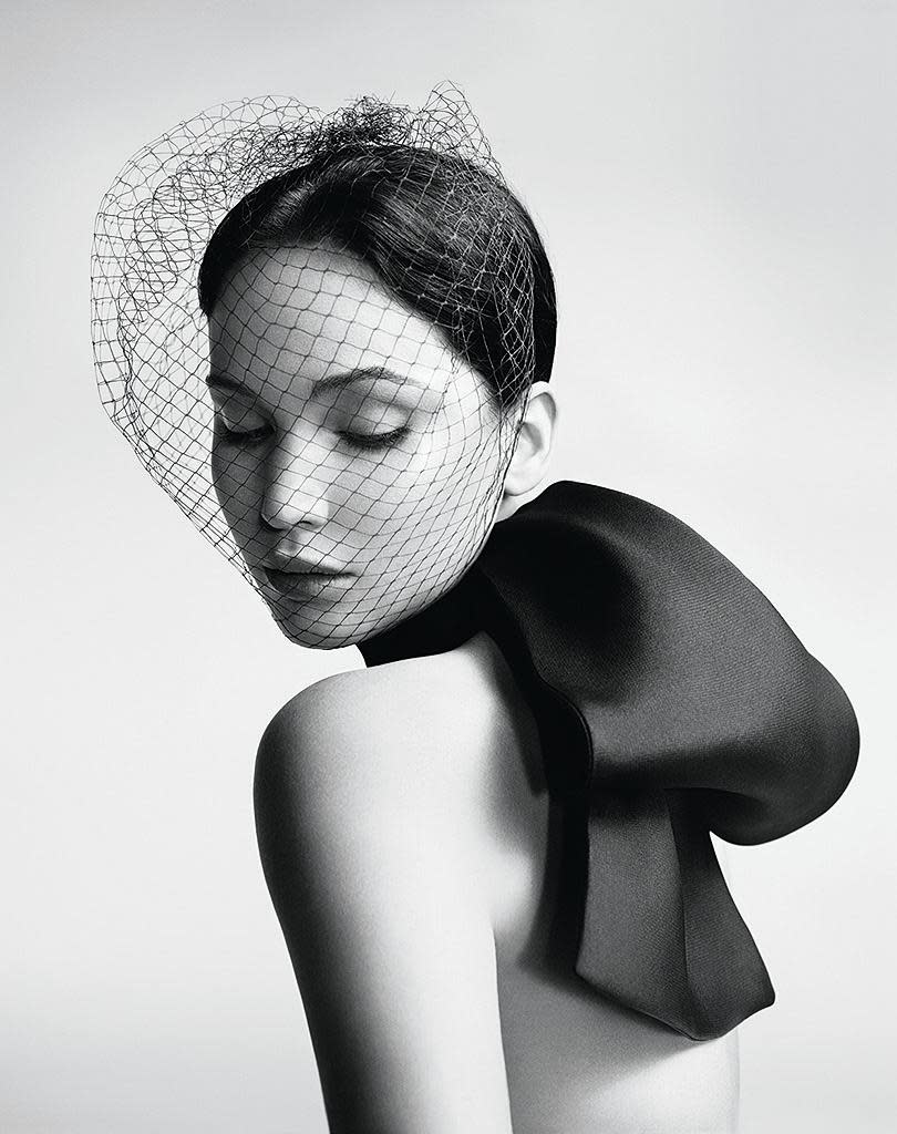 A netted veil gives Jen a glamorous air of mystery.