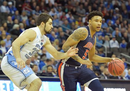 Mar 29, 2019; Kansas City, MO, United States; Auburn Tigers forward Chuma Okeke (5) controls the ball against North Carolina Tar Heels forward Luke Maye (32) during the first half in the semifinals of the midwest regional of the 2019 NCAA Tournament at Sprint Center. Mandatory Credit: Denny Medley-USA TODAY Sports