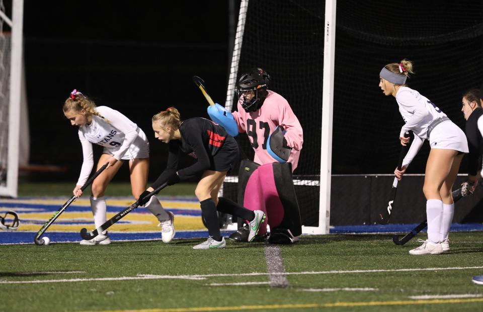 Webster Thomas' Kristina Fisher tries to bring the ball around to try and score on Penfield's goalie Aubrey Hare. Trying to stop her is Penfield's Raina Sears while Webster Thomas' Kennedi Spencer waits for a pass.