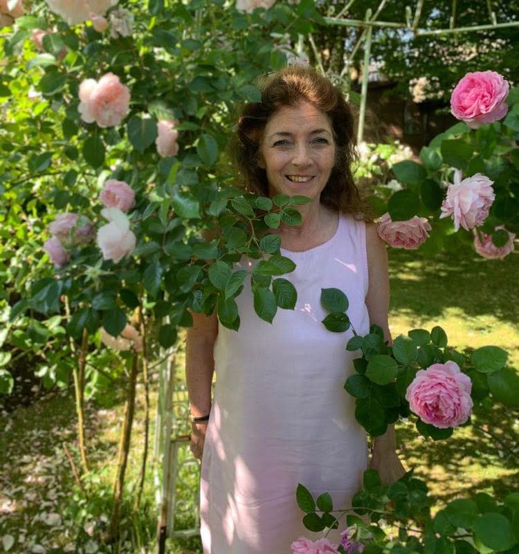 Caroline Sampson standing among flowers outside. (Supplied)