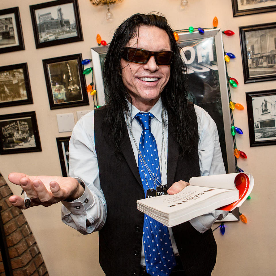 Tommy holding the book written after the movie