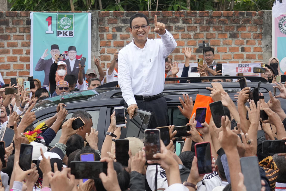 FILE - Indonesian Presidential candidate Anies Baswedan greets supporters during his campaign rally in Bandar Lampung, Indonesia, Sunday, Jan. 14, 2024. Indonesians on Wednesday, Feb. 14, 2024 will elect the successor to popular President Joko Widodo, who is serving his second and final term. It is a three-way race for the presidency among current Defense Minister Prabowo Subianto and two former governors, Anies Baswedan and Ganjar Pranowo. (AP Photo/Achmad Ibrahim, File)