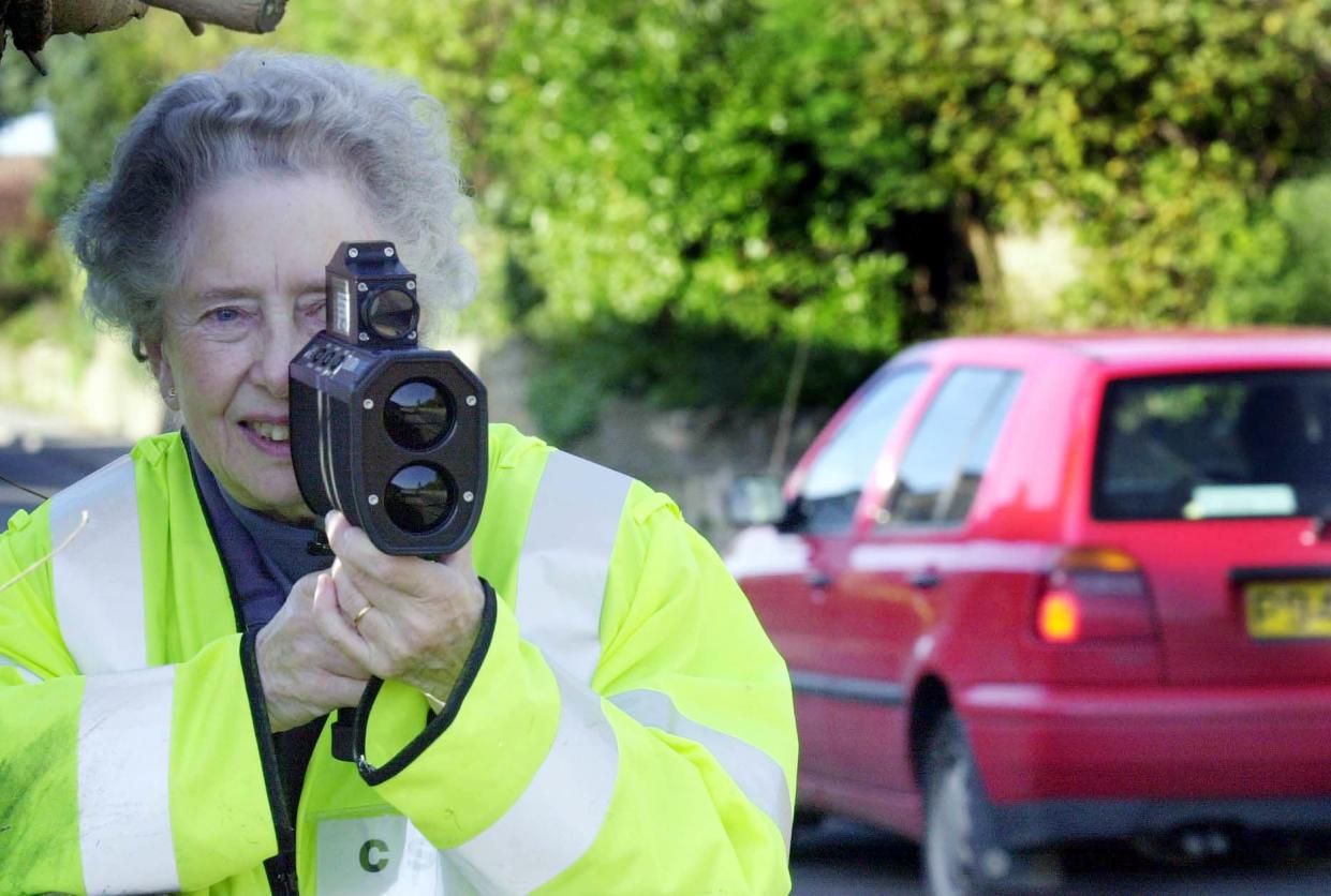 An archive photo shows a volunteer in Ash, Somerset, with a speed gun.  (PA)