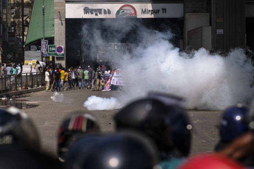 Police fire tear gas shells to disperse Bangladeshi garment factory workers who were blocking traffic demanding better wages at Dhaka-Mirpur area in Bangladesh, Thursday, Nov.2, 2023. (AP Photo/Mahmud Hossain Opu)