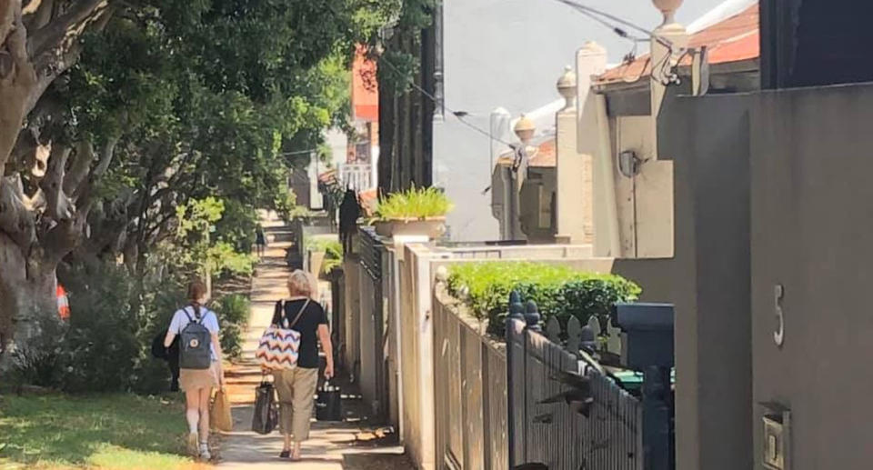 School girl pictured walking with lady she rushed to help with bags in Bondi Junction, Sydney.