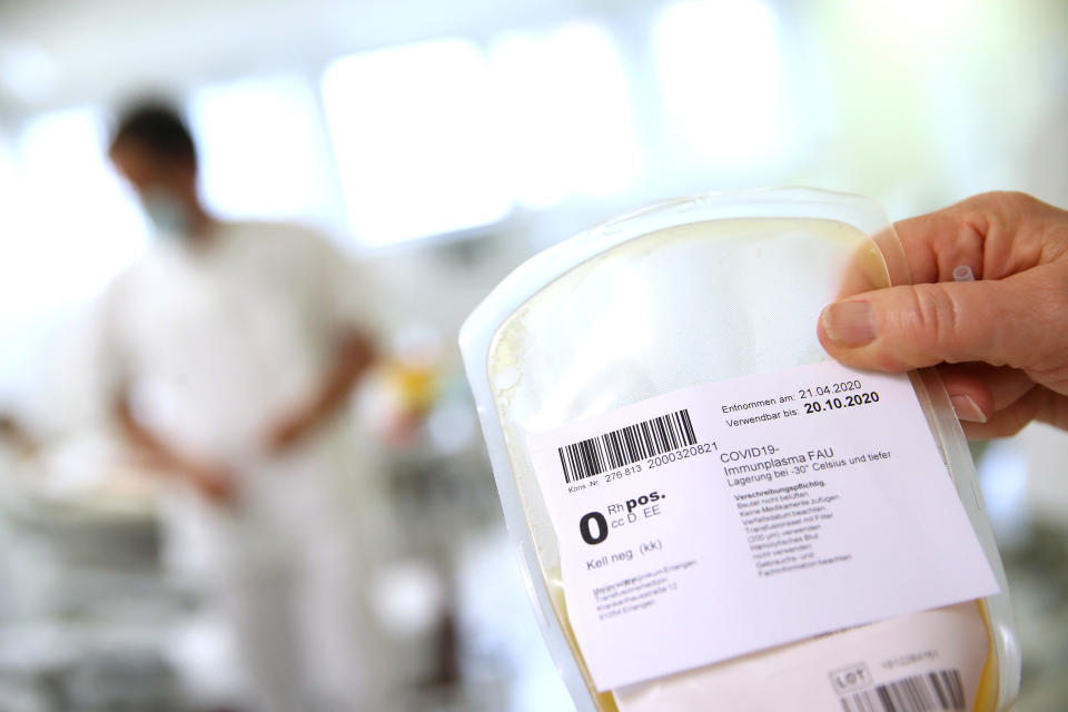 ERLANGEN, GERMANY - APRIL 27: A medical researcher at the German Center for Immunity Therapy (das Deutsche Zentrum Immuntherapie, or DZI) holds a bag containing blood plasma from a recovered Covid-19 patient at the University Hospital Erlangen during the novel coronavirus crisis on April 27, 2020 in Erlangen, Germany. The DZI is among several research facilities across Germany conducting research and tests over whether blood plasma that contains the antibodies from recovered Covid-19 patients might provide a therapy for other Covid-19 patients still battling with the disease. Germany currently has over 150,000 confirmed cases of Covid-19 infection, 103,000 people have recovered and approximately 6,000 people have died. (Photo by Alexander Hassenstein/Getty Images)