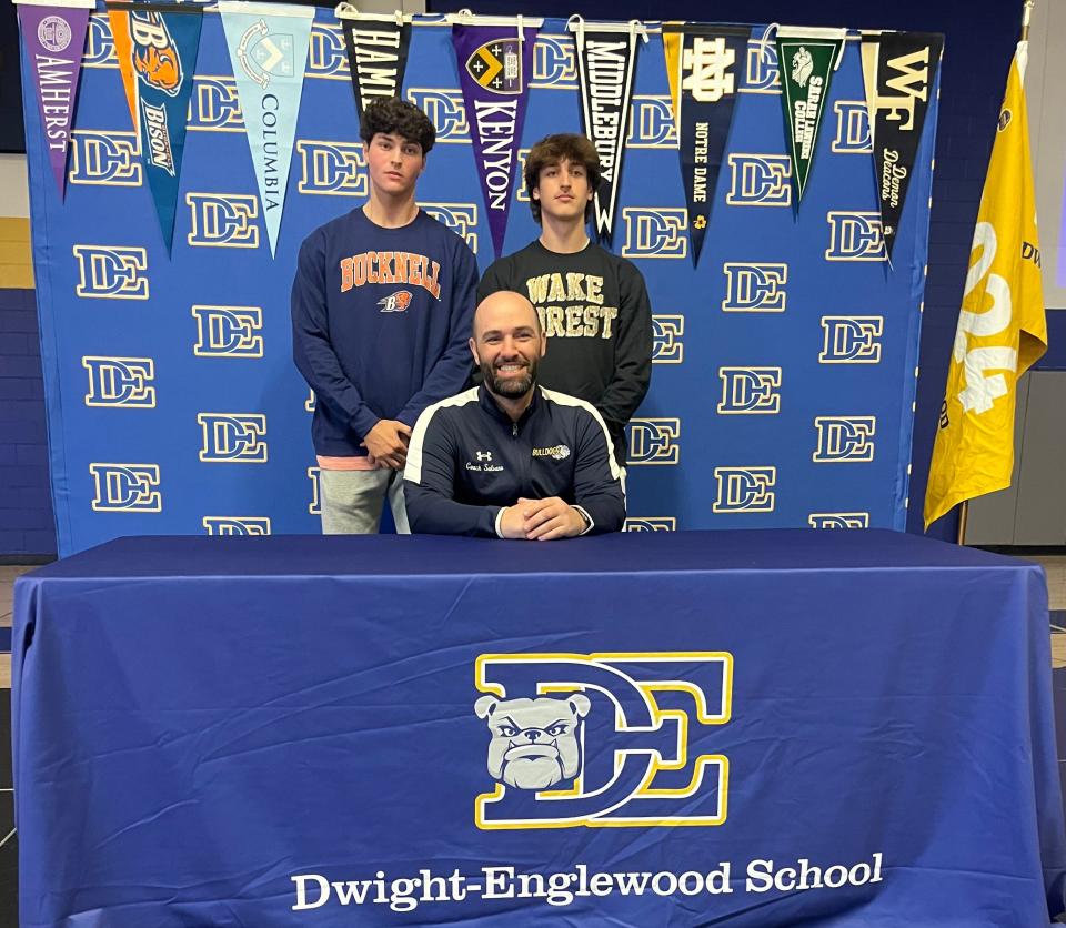 Dwight-Englewood seniors Everett Garber (left) and Rhys Bowie (right) were joined by baseball coach Frank Salvano Jr. for a letter-of-intent signing ceremony at the school on Wednesday, April 17, 2024. The pitchers committed to Bucknell and Wake Forest, respectively.